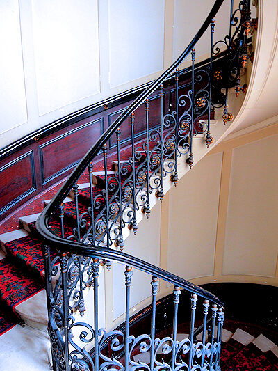 Although there is a lift to the 3rd floor apartment, descending the sweeping Haussmann staircase speaks to the apartment's elegant Parisian location.