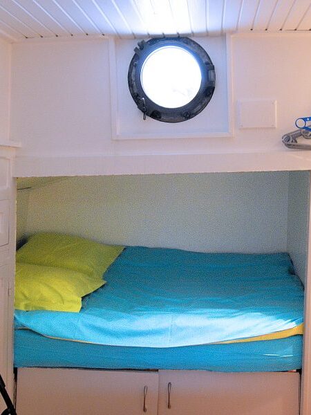 The double bed in Bedroom 2 is cleverly recessed into a shadowbox.