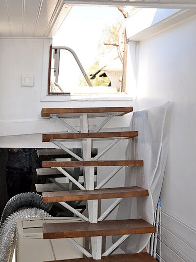 The entry steps from the boat deck down into the apartment.