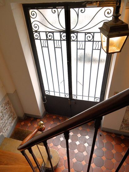 The Place des Galeries apartment is accessed via this door and two flights of stairs.