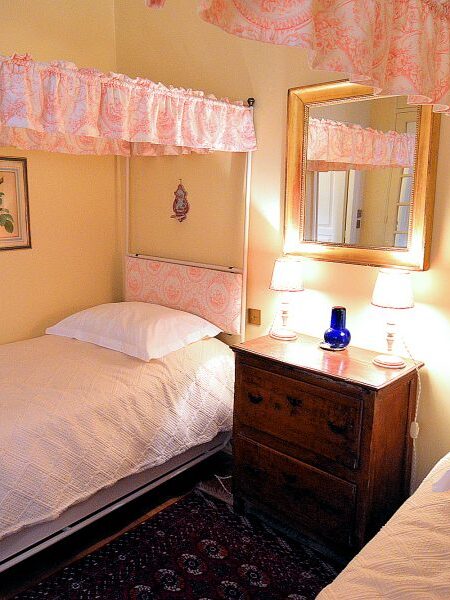 The second bedroom at the Place des Galeries apartment has twin beds.