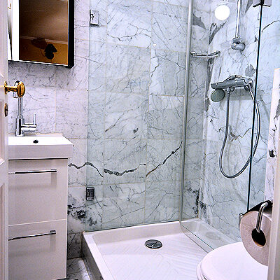 The apartment has 2 bathrooms. This one has a shower but no tub.