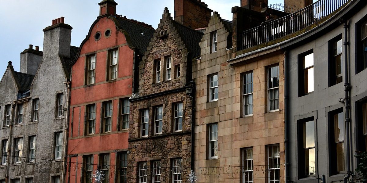 Classic Old Town building facades line West Bow street at Grassmarket.