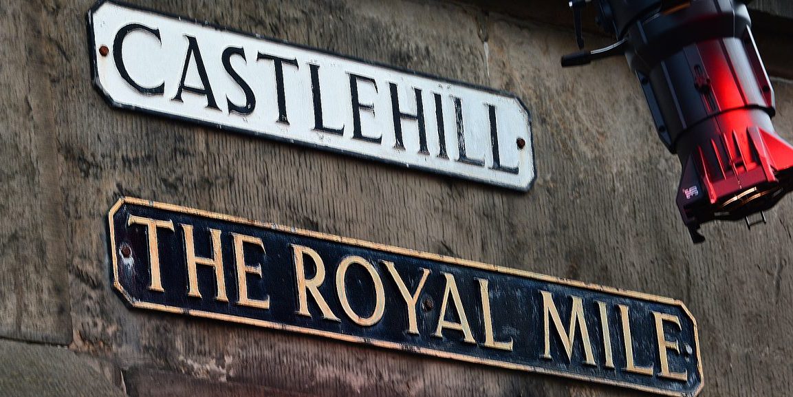 Street signs atop the Royal Mile at Castle Hill