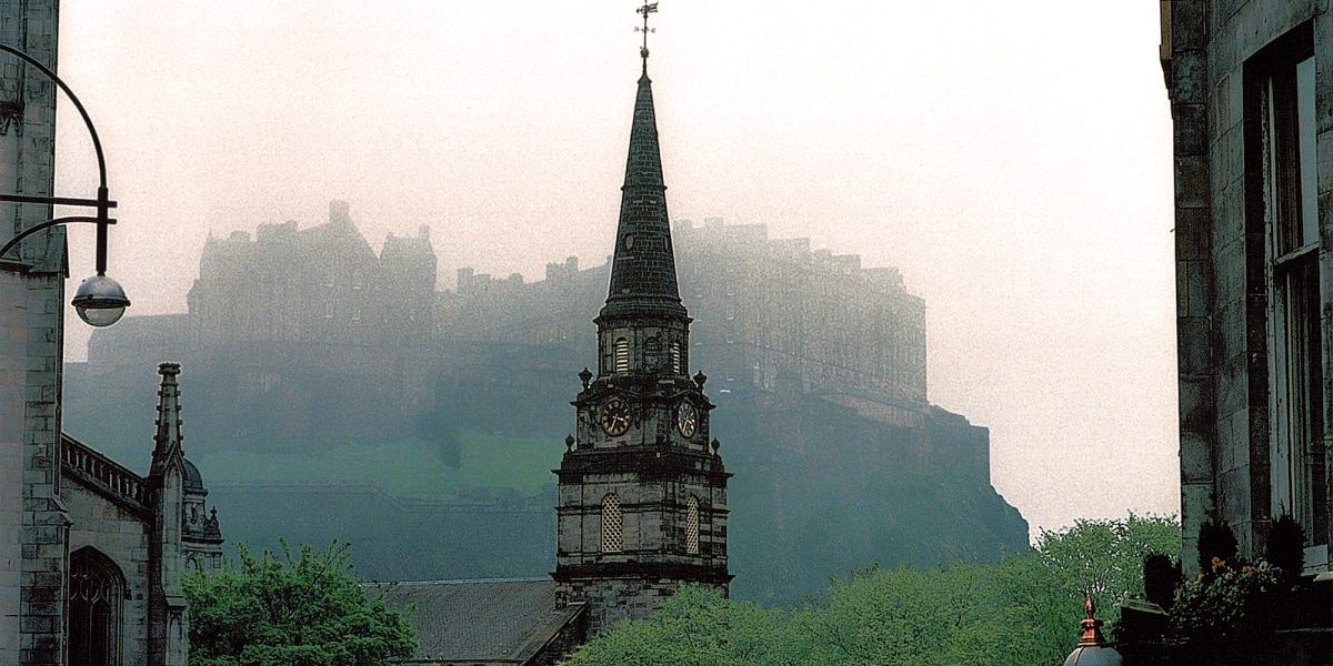 Edinburgh Castle in the fog above New Town.