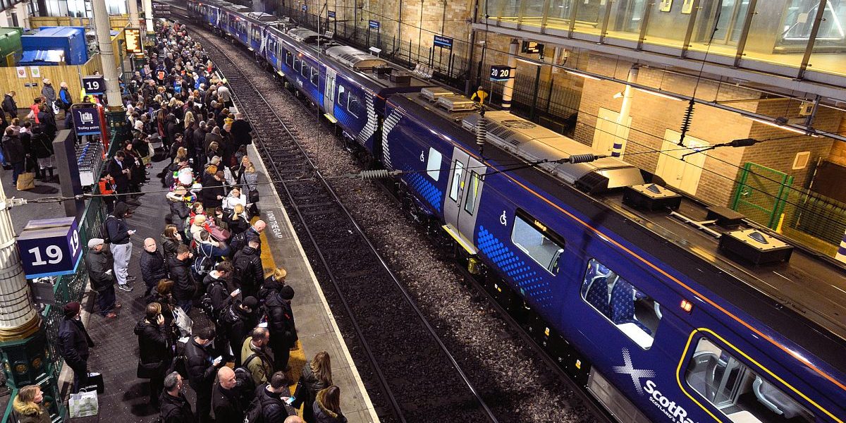 Edinburgh: commuters waiting for their train at Waverley Station.