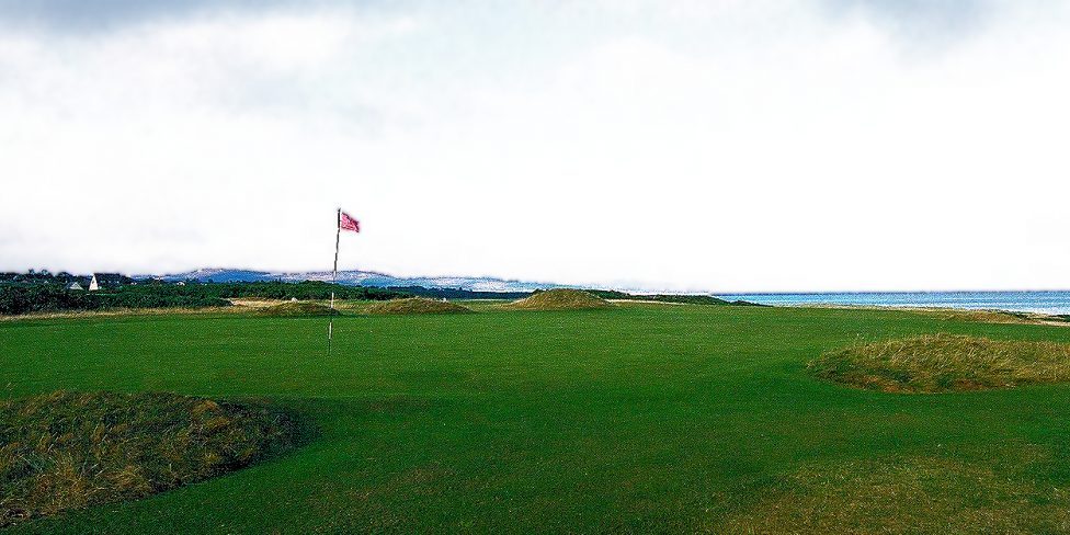 Northern Scotland's Royal Dornoch Golf Club green overlooking the North Sea.