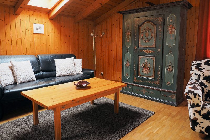Chalet Altels - East Apt - living room w. antique wardrobe