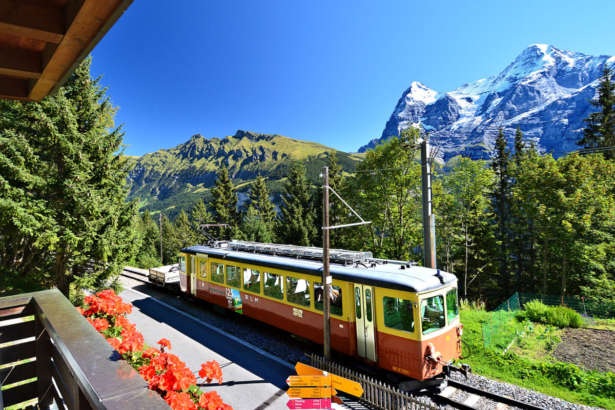 Chalet Eiger: 2-bedroom apartment balcony view with BLM train and Eiger/Mönch. Photo © Home At First.