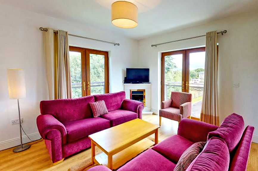 Killaloe Townhouses: living room with flat-screen TV. Photo courtesy the owners.