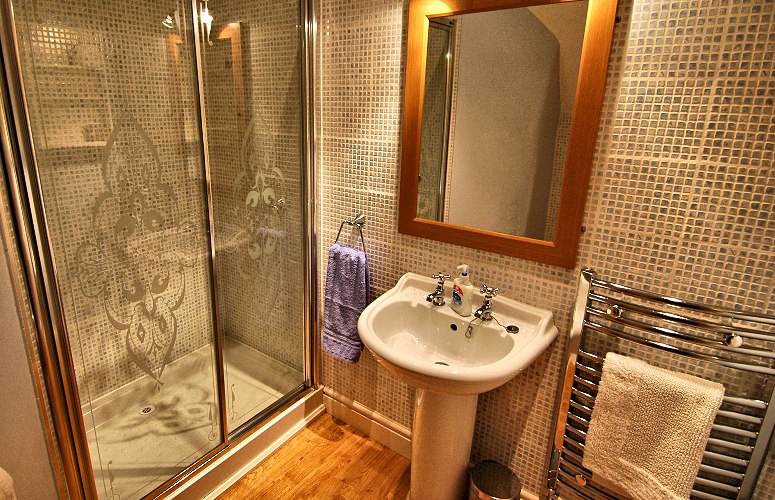 Bretforton cottage bathroom with shower. Photo copyright Home At First.