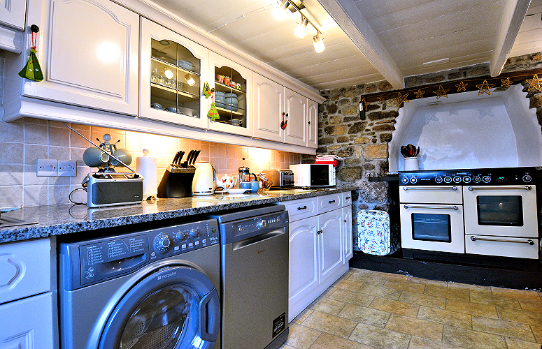 Coverack: Stone Thatched Cottage — well-equipped kitchen. Photo copyright Home At First.