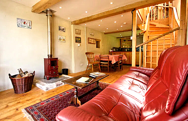 West Devon Farm Cottage 2: living room, kitchen, & stairs. Photo courtesy the owners.