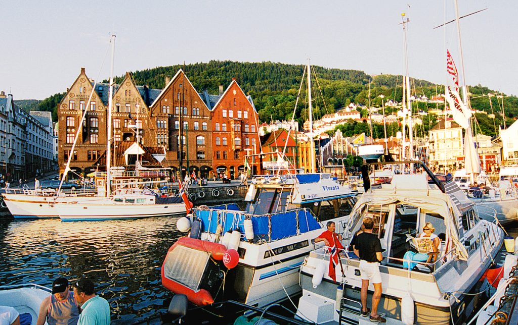 Bergen: Bryggen Harbor busy with boats. Photo copyright Home At First.