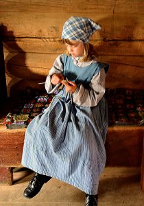 Lillehammer: Girl knitting at Maihaugen Open-Air Museum. Photo copyright Home At First.