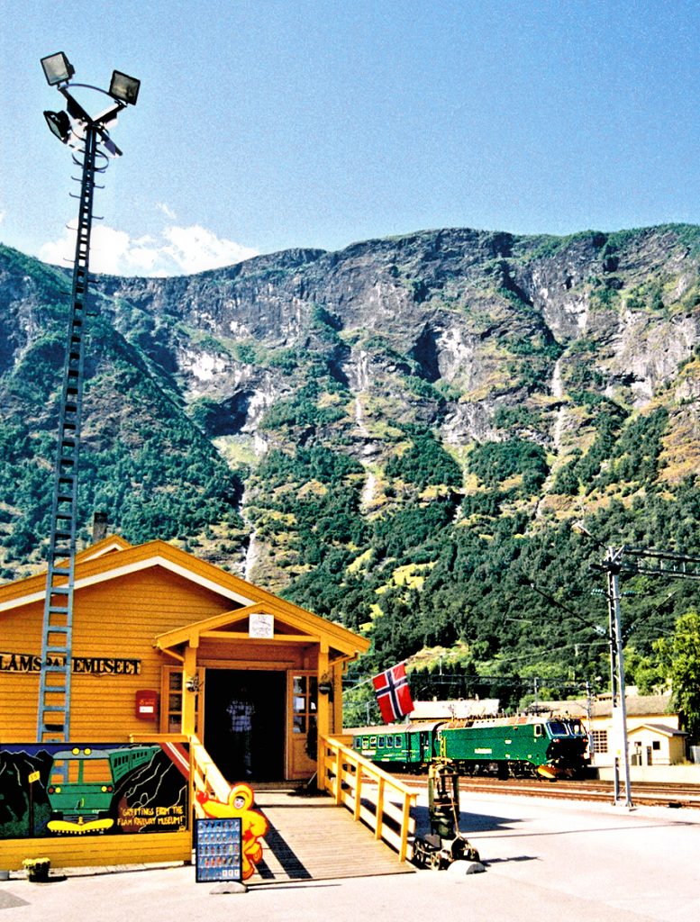 Flåm on the Sogne Fjord: Train arriving by Flåmsbana Railway Museum. Photo © Home At First.