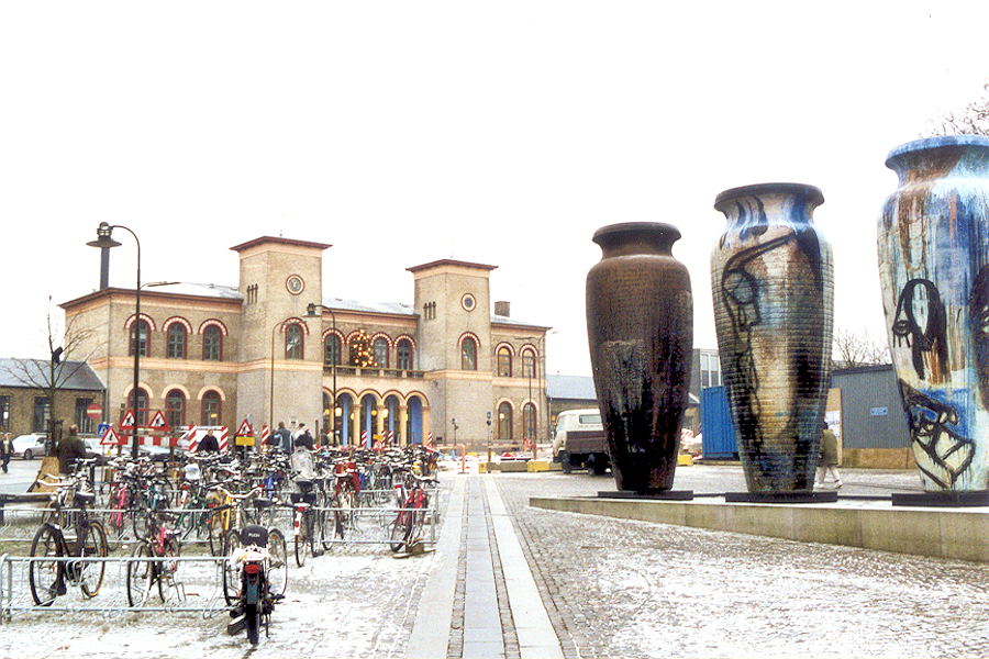 Roskilde train station with huge jars and bikes. Photo © Home At First.