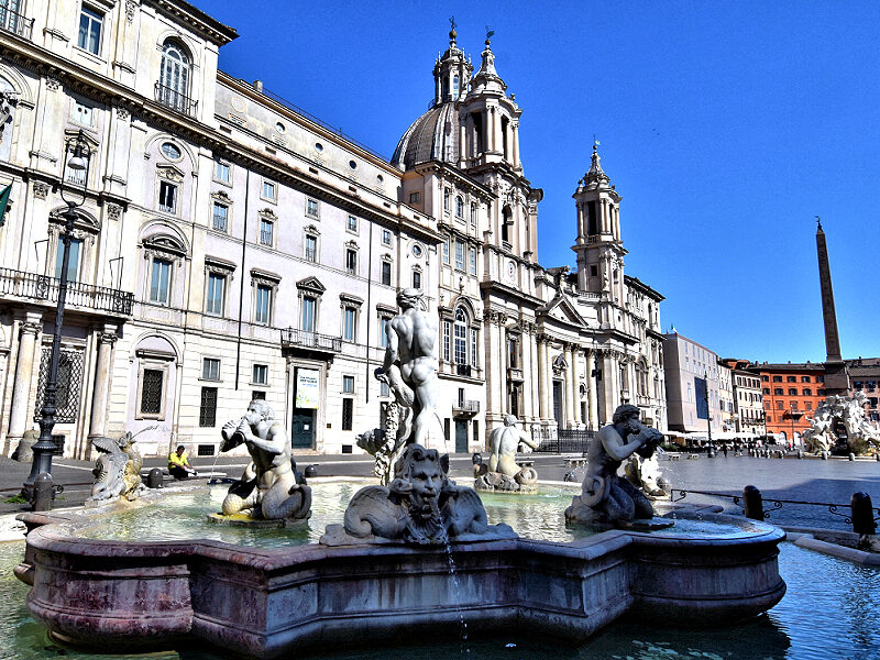 High Baroque buildings and fountains are found at Rome's Piazza Navona. Bernini's Neptune wrestles a dolphin as the centerpiece of the Fontana del Moro. Photo © Home At First.