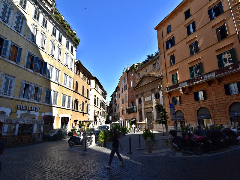 The streets of old central Rome are a maze of narrow alleys that invite exploring. At some intersections, like here at Piazza di Pasquino, the space opens enough to let the Roman sun shine in. Photo © Home At First.