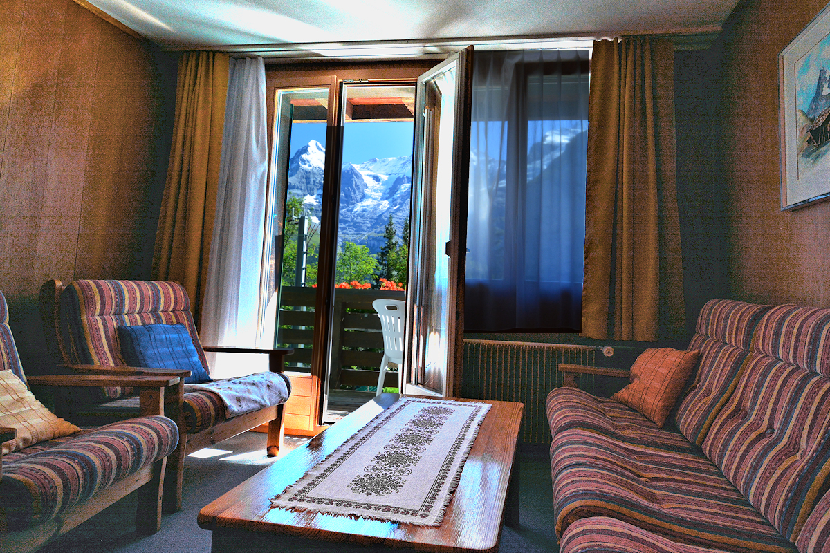 Balcony view of the Bernese Alps from the living room of a 2-bedroom apartment. Photo © Home At First.