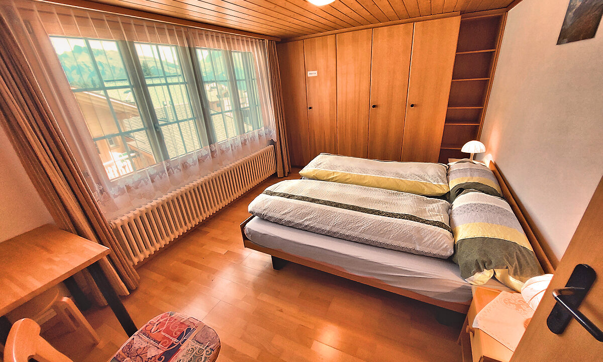 Chalet Silberhorn - Upper Apt: Twin Bedroom with Garden View. Photo © Home At First.