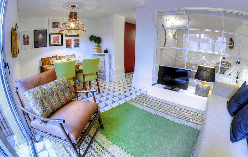 1-Bdrm Apt: Livingroom-diningarea-airconditioning-tv-bedroombehindglass. Photo courtesy the owner.