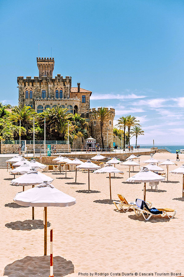 Lisbon Region: Tamoriz beach with umbrellas & Forte da Cruz. Photo by Rodrigo Costa Duarte © Cascais Tourism Board.