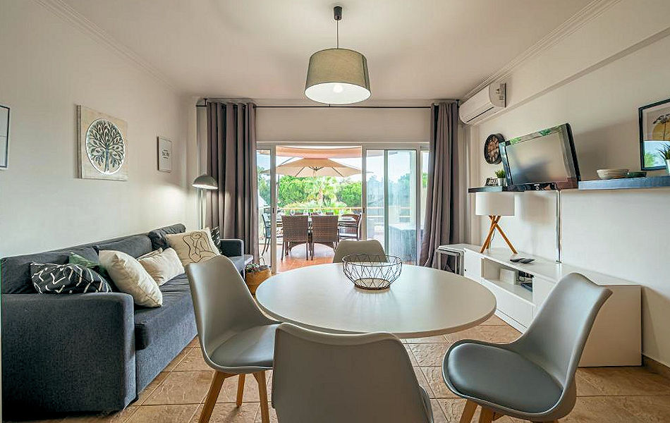 Vilamoura Golf Central Apartment - Surrounded by golf courses: dining and living area with furnished terrace. Photo courtesy the agency.